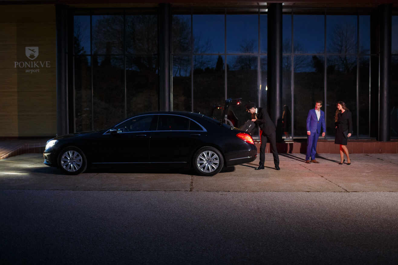 a group of men standing outside a building