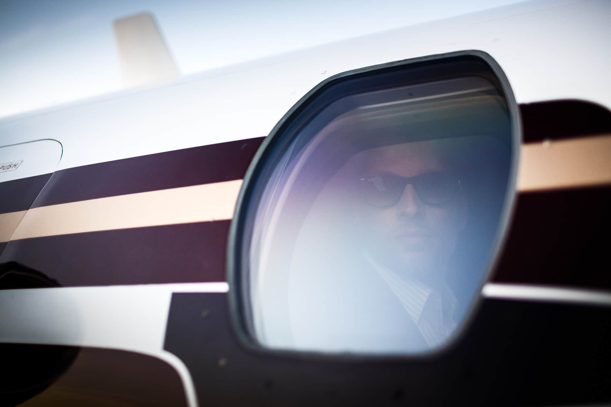 Passenger Looking Through The Airplane Window