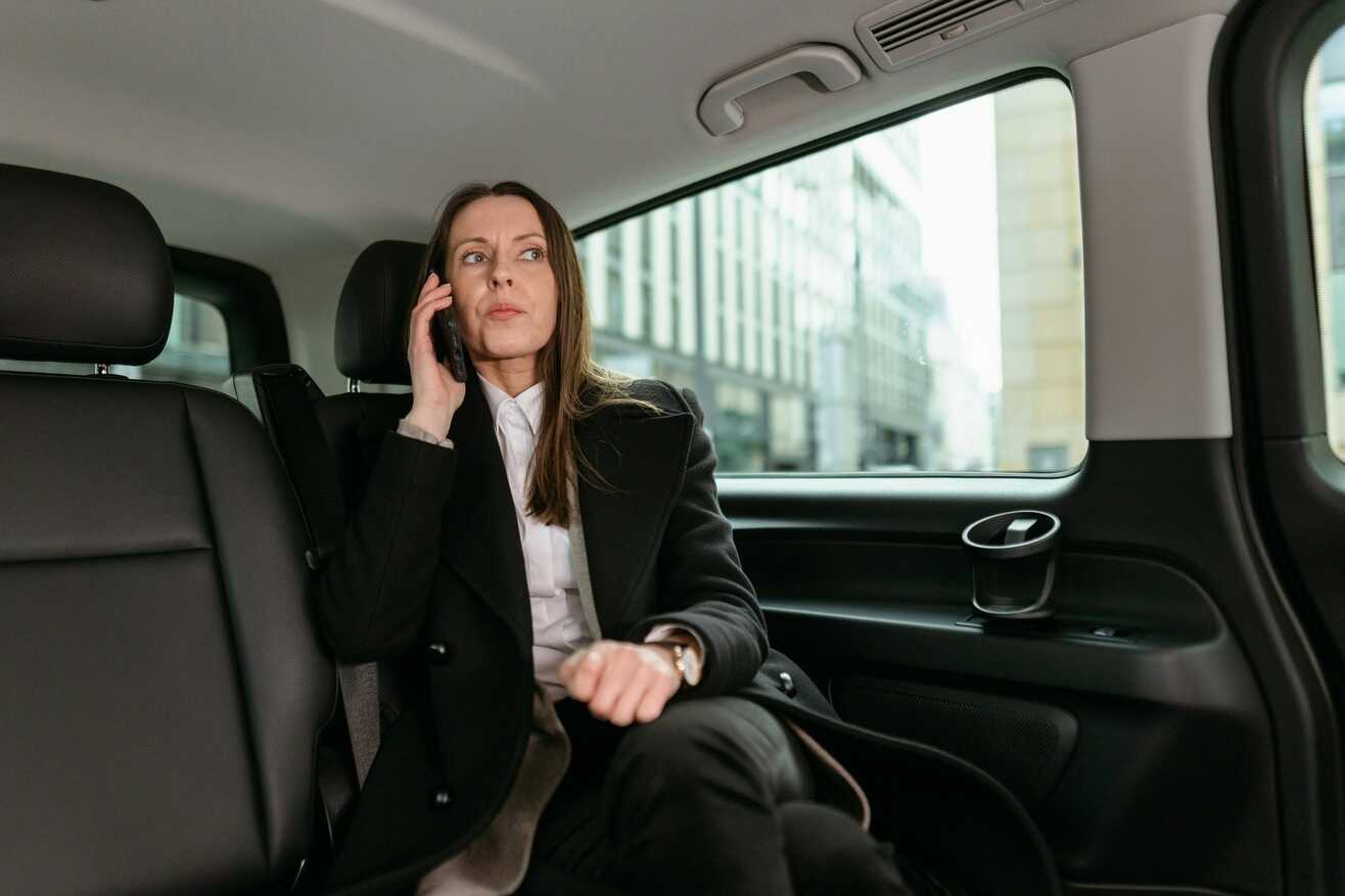 Woman talking on a phone on a business trip