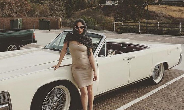 Lady Gaga in front of a limo